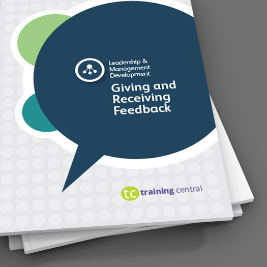 Image shows a close up of the cover of the workbook for Training Central's Giving and Receiving Feedback training materials.